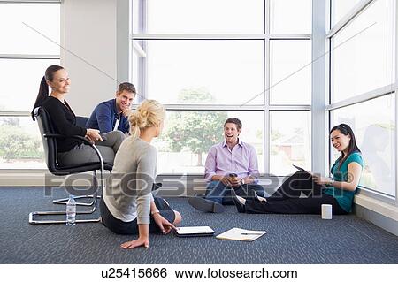 Business executives at brainstorming meeting View Large Photo Image Stock Photograph - Business executives at brainstorming meeting. Fotosearch