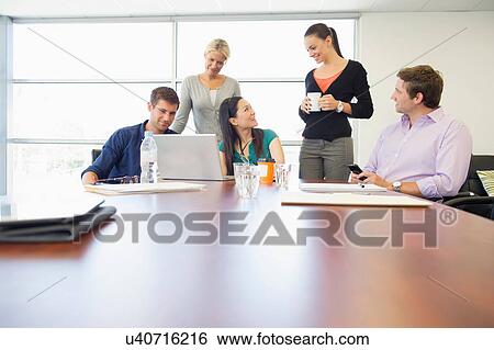 Business executives at brainstorming meeting View Large Photo Image Stock Photograph - Business executives at brainstorming meeting. Fotosearch