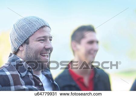 Stock Image - Candid portrait of two young men. Fotosearch