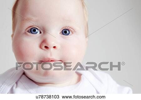 Close up of baby girl biting lip View Large Photo Image Stock Image - Close up of baby girl biting lip. Fotosearch