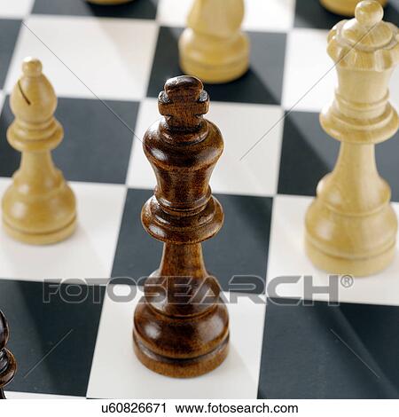 Close up of chess pieces on board View Large Photo Image Stock Image - Close up of chess pieces on board. Fotosearch