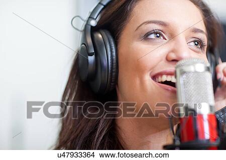Picture - Close up of young female singer. Fotosearch