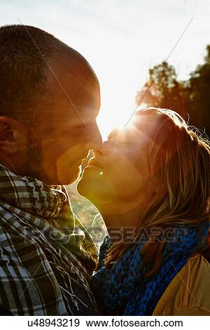Stock Photo - Couple kissing. Fotosearch