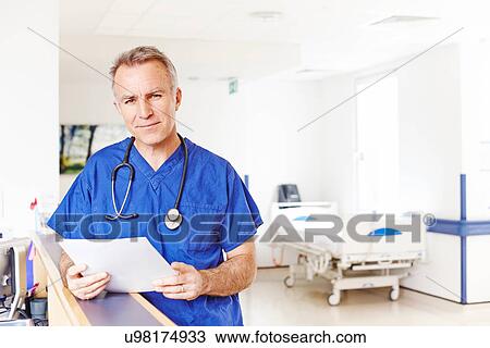 Stock Image - Doctor holding notes. Fotosearch