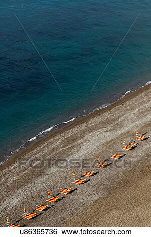 Empty beach chairs on Positano beach, on the Amalfi Peninsula, Campania, Italy View Large Photo Image Stock Photograph - Empty beach chairs on Positano beach, on the Amalfi Peninsula, Campania, Italy. Fotosearch
