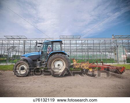 Female farmer in tractor on herb farm View Large Photo Image Stock Photo - Female farmer in tractor on herb farm. Fotosearch