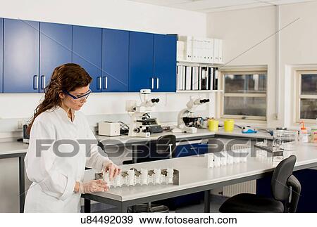Female scientist working in laboratory View Large Photo Image Stock Photo - Female scientist working in laboratory. Fotosearch