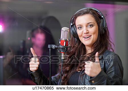 Female singer in recording studio View Large Photo Image Stock Photography - Female singer in recording studio. Fotosearch