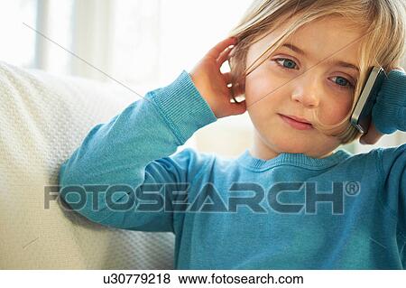 Stock Photo - Girl making phonecall using smartphone. Fotosearch