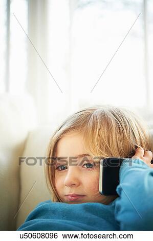 Girl making phonecall using smartphone View Large Photo Image Stock Photograph - Girl making phonecall using smartphone. Fotosearch