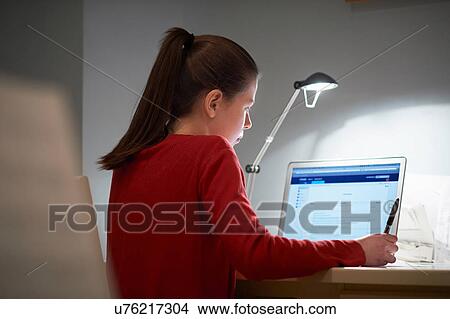 Picture - Girl using laptop computer. Fotosearch