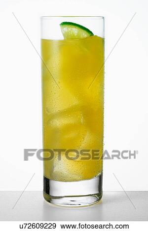 Glass of orange juice with lime View Large Photo Image Stock Photo - Glass of orange juice with lime. Fotosearch