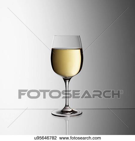 Stock Image - Glass of white wine. Fotosearch