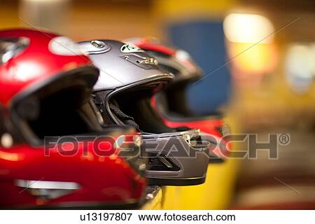 Stock Photo - Go carting crash helmets in a row. Fotosearch