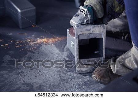 Picture - Grinding in cast iron foundry. Fotosearch