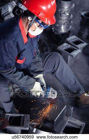 Stock Photo - Grinding in cast iron foundry. Fotosearch