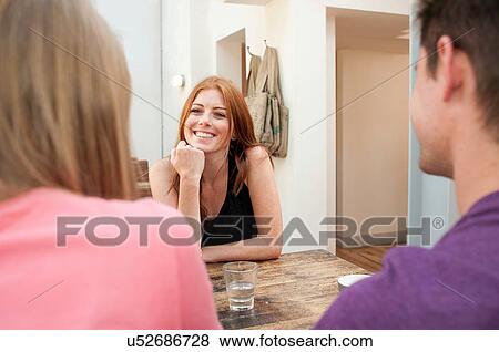 Group of friends talking in cafe View Large Photo Image Stock Photo - Group of friends talking in cafe. Fotosearch