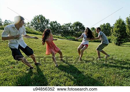 Group of young adults playing tug of war View Large Photo Image Stock Image - Group of young adults playing tug of war. Fotosearch