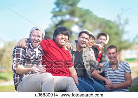Group of young men fooling about View Large Photo Image Picture - Group of young men fooling about. Fotosearch