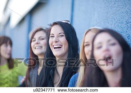 Group of young women fooling about View Large Photo Image Stock Image - Group of young women fooling about. Fotosearch