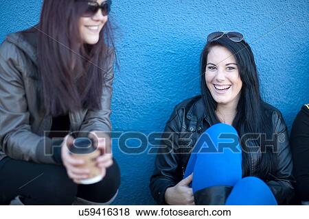 Group of young women with takeaway coffee View Large Photo Image Stock Photo - Group of young women with takeaway coffee. Fotosearch