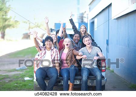 Group portrait of young adult friends in back of pickup View Large Photo Image Stock Photo - Group portrait of young adult friends in back of pickup. Fotosearch