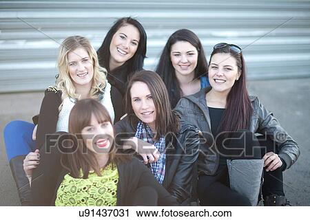 Stock Image - Group portrait of young female friends. Fotosearch