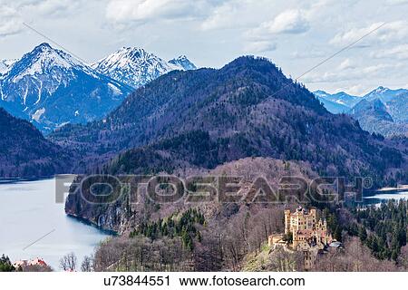 Hohenschwangau Castle (Schloss Hohenschwangau), Alpsee and Schwansee - view from Neuschwanstein Castle. Bavaria, Germany View Large Photo Image Stock Image - Hohenschwangau Castle (Schloss Hohenschwangau), Alpsee and Schwansee - view from Neuschwanstein Castle. Bavaria, Germany. Fotosearch