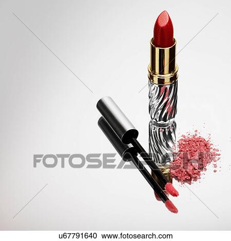 Stock Image - Lipstick, lipgloss and eyeshadow. Fotosearch