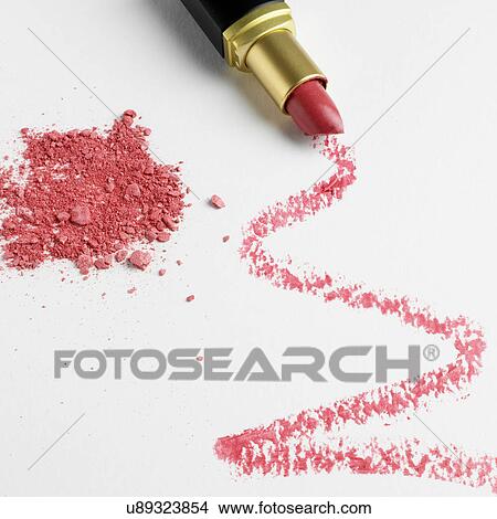 Picture - Lipstick zigzag pattern on white background with make up powder. Fotosearch