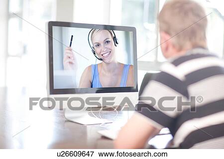 Man using computer for video call View Large Photo Image Stock Photo - Man using computer for video call. Fotosearch