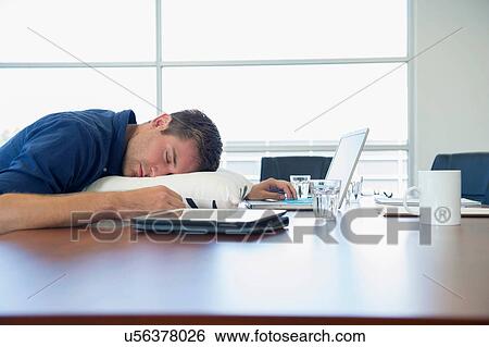 Over-worked business executive sleeping at desk View Large Photo Image Stock Photograph - Over-worked business executive sleeping at desk. Fotosearch