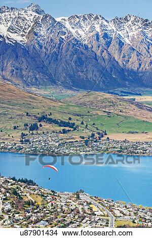 Paragliding over Queenstown, South Island, New Zealand View Large Photo Image Picture - Paragliding over Queenstown, South Island, New Zealand. Fotosearch