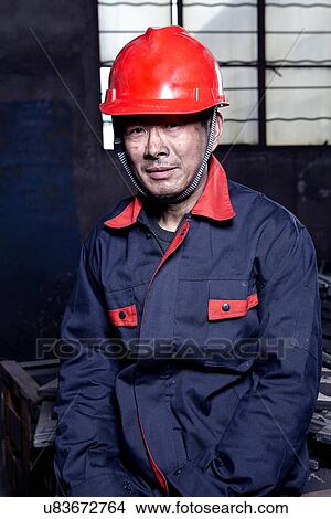 Picture - Portrait of man working in cast iron foundry. Fotosearch