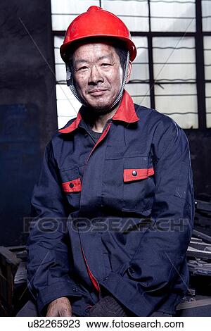 Portrait of man working in cast iron foundry View Large Photo Image Stock Image - Portrait of man working in cast iron foundry. Fotosearch