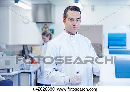 Stock Image - Portrait of researcher in laboratory. Fotosearch