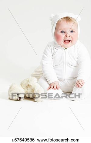 Portrait of smiling baby girl and teddy bear View Large Photo Image Stock Photograph - Portrait of smiling baby girl and teddy bear. Fotosearch