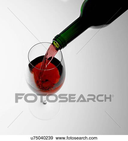 Pouring red wine into glass View Large Photo Image Stock Photo - Pouring red wine into glass. Fotosearch