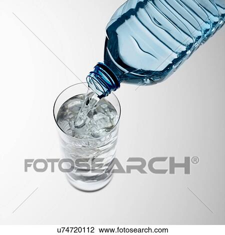 Pouring water into glass View Large Photo Image Stock Image - Pouring water into glass. Fotosearch
