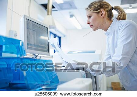 Researcher using computer View Large Photo Image Stock Photo - Researcher using computer. Fotosearch