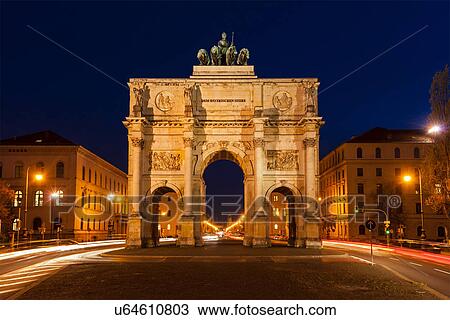 Stock Image - Siegestor (Victory Gate) in the evening, long exposure, Munich, Bavaria, Germany. Fotosearch