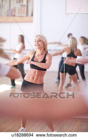 Picture - Small group enjoying aerobic class. Fotosearch