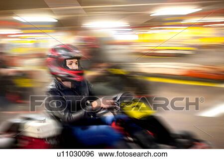 Teenage girl driving go cart on track View Large Photo Image Stock Photograph - Teenage girl driving go cart on track. Fotosearch