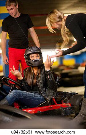 Teenage girl sitting in go cart after accident View Large Photo Image Stock Image - Teenage girl sitting in go cart after accident. Fotosearch