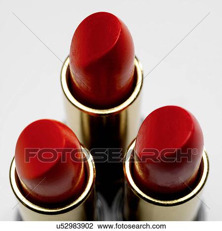 Stock Image - Three red lipsticks. Fotosearch