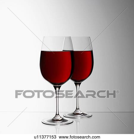 Stock Image - Two glasses of red wine. Fotosearch