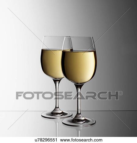 Two glasses of white wine View Large Photo Image Stock Image - Two glasses of white wine. Fotosearch