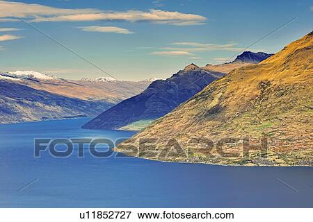 Stock Photo - View across Lake Wakatipu, Queenstown, South Island, New Zealand. Fotosearch