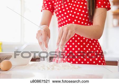 Stock Image - Woman baking. Fotosearch