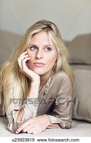 Woman daydreaming in bed View Large Photo Image Stock Photo - Woman daydreaming in bed. Fotosearch